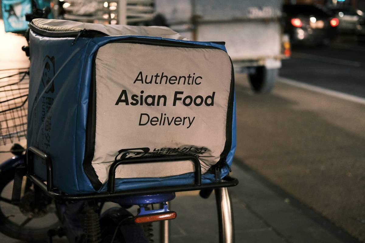 A cluttered kitchen counter with ingredients spilled everywhere.