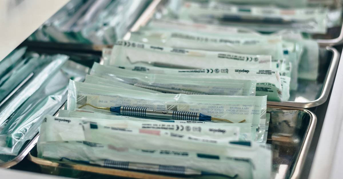 Organized and packaged dental supplies in a drawer.