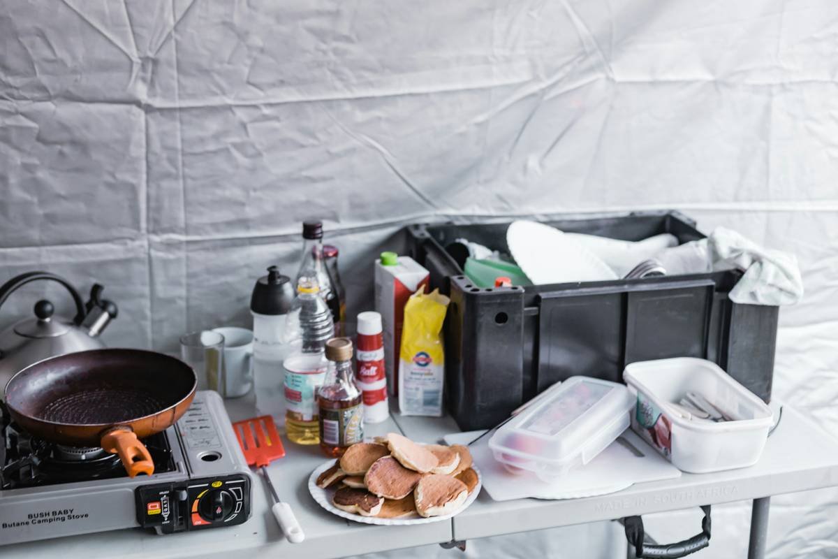 a table topped with a frying pan next to a frying pan